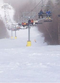 skiers on a chair lift at Stratton photo by Scenes of Vermont